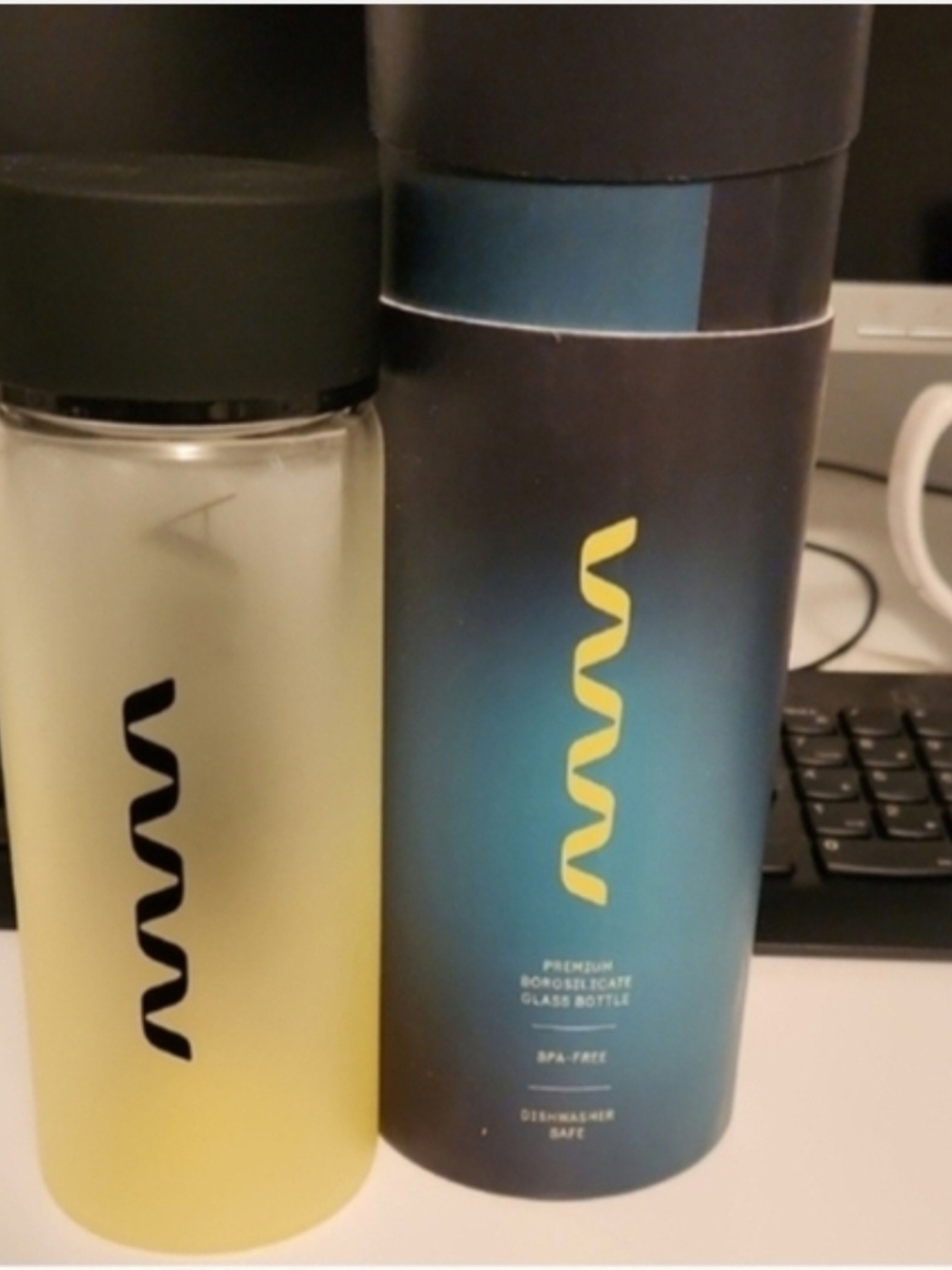 Glass Water Bottle with Yellow Spiral Logo